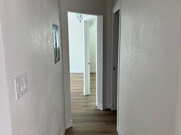 Hallway, first door on the right is Guest Bedroom, 2nd door on the right is Master Bedroom. Laundry and Guest Bathroom to the left. Living Room straight ahead with Sliding Door to backyard.