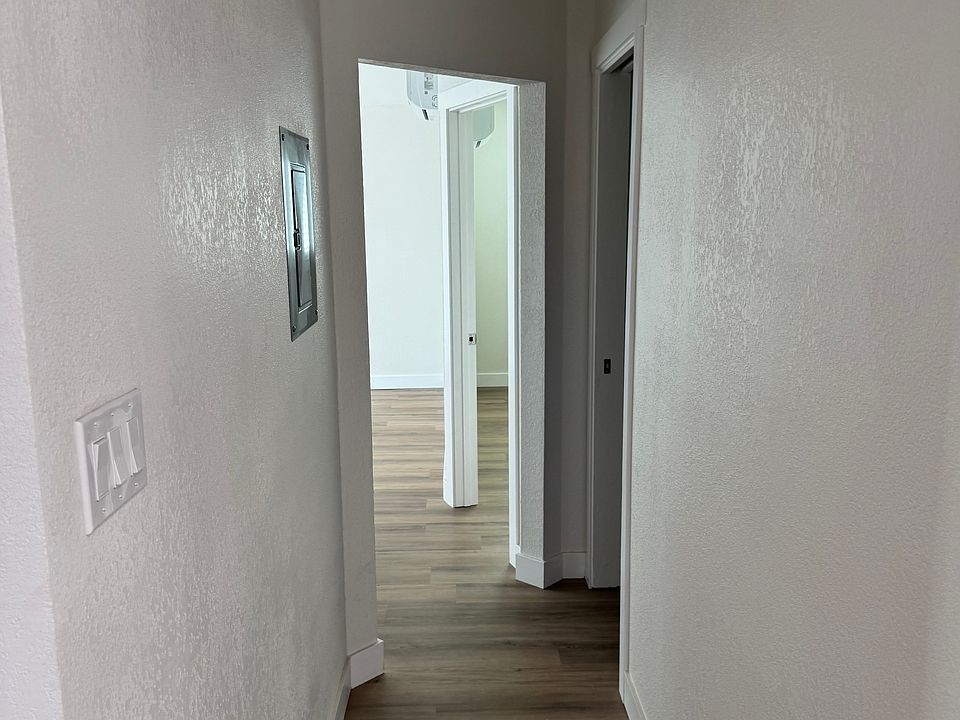 Hallway, first door on the right is Guest Bedroom, 2nd door on the right is Master Bedroom. Laundry and Guest Bathroom to the left. Living Room straight ahead with Sliding Door to backyard.