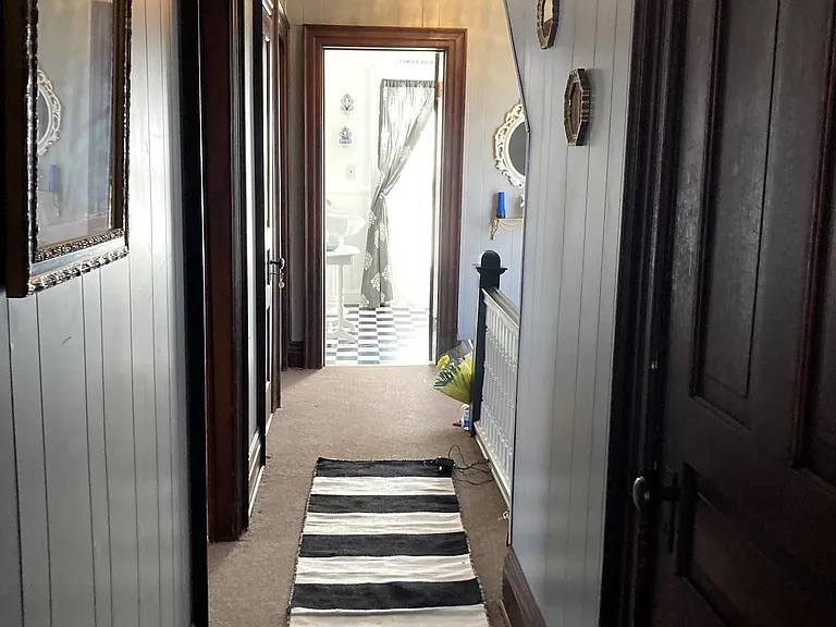 Second floor hallway from Queen Bee suite to bathroom.