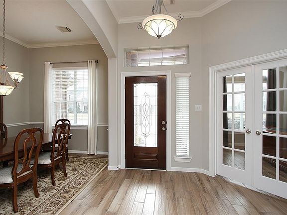 View looking back towards the front door with study to the right and dining room to the left.