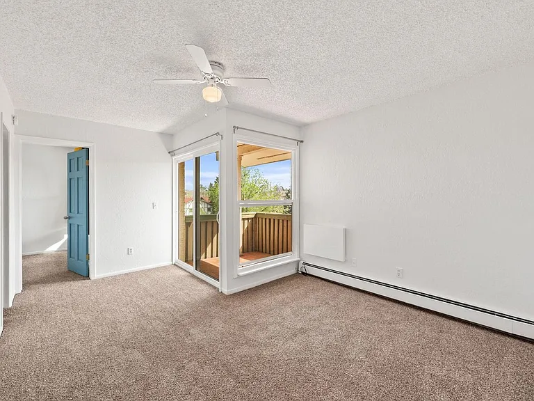 Upper floor living room with new carpet.