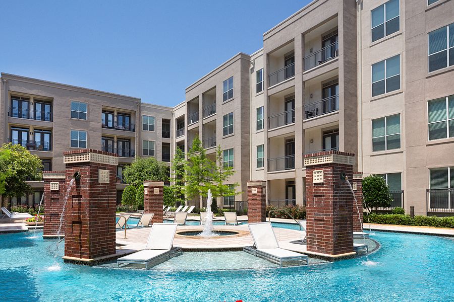 Resort-style swimming pool with tanning areas