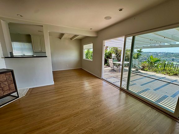 Living room, dining area and partial kitchen view
