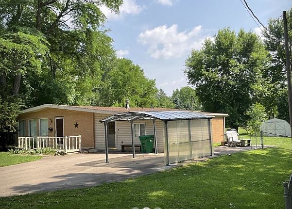 Outside on a spacious 1/2 acre lot.