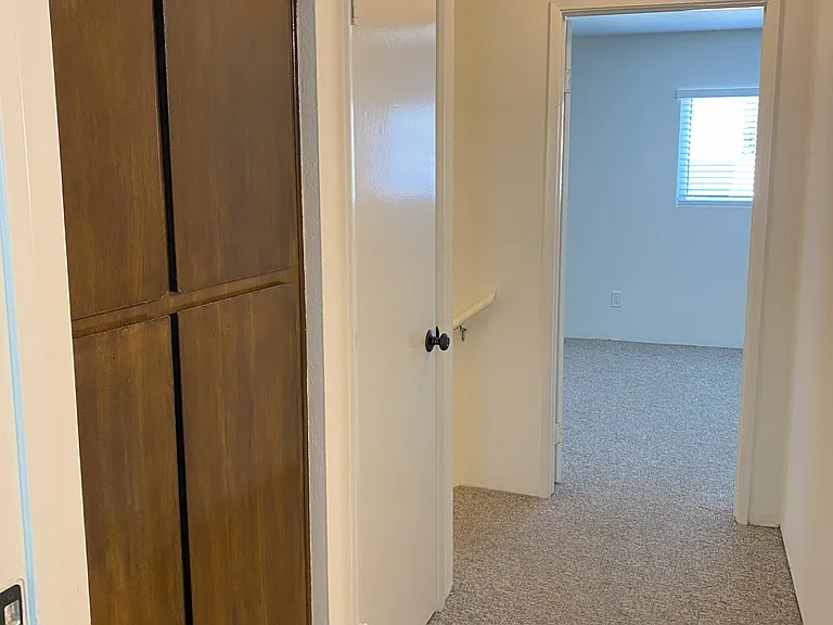 Upstairs hallway between both bedrooms. Lots of closet space