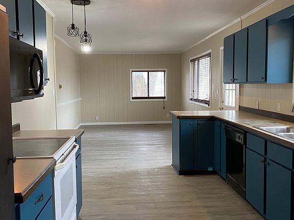 Kitchen with new microwave and fridge
