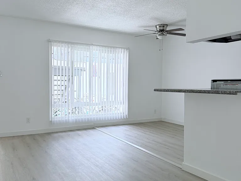 Living room overlooking dining and entry area