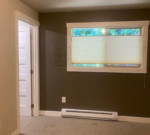Bedroom has up/down shades for light or privacy