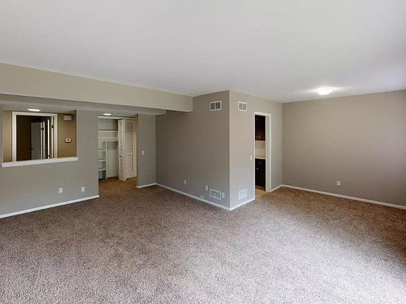 Living room/dining room space that leads to the kitchen