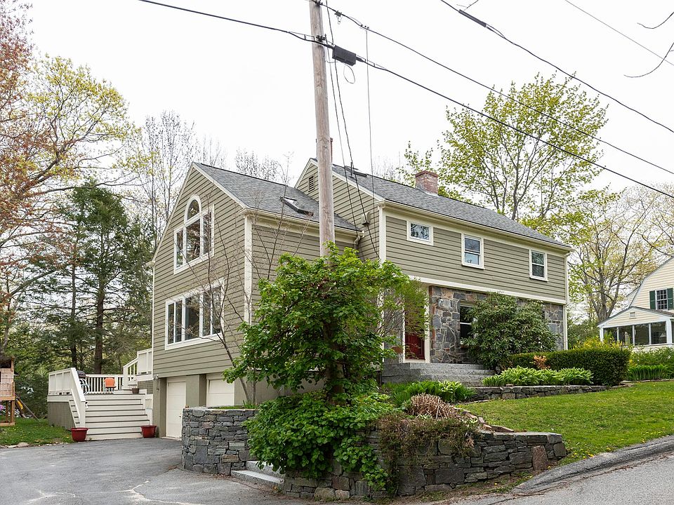 Front exterior with driveway and 2 car garage