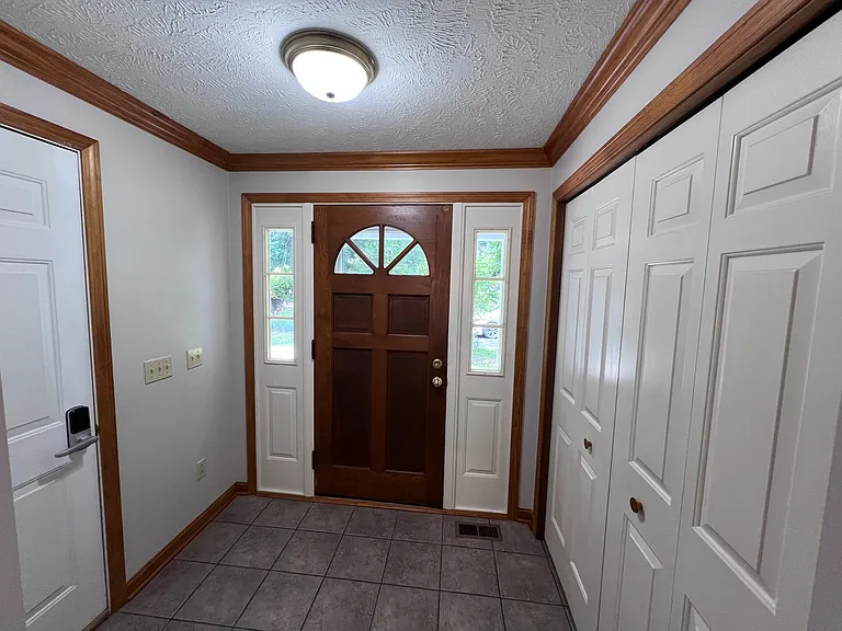 Front door has huge coat closet.