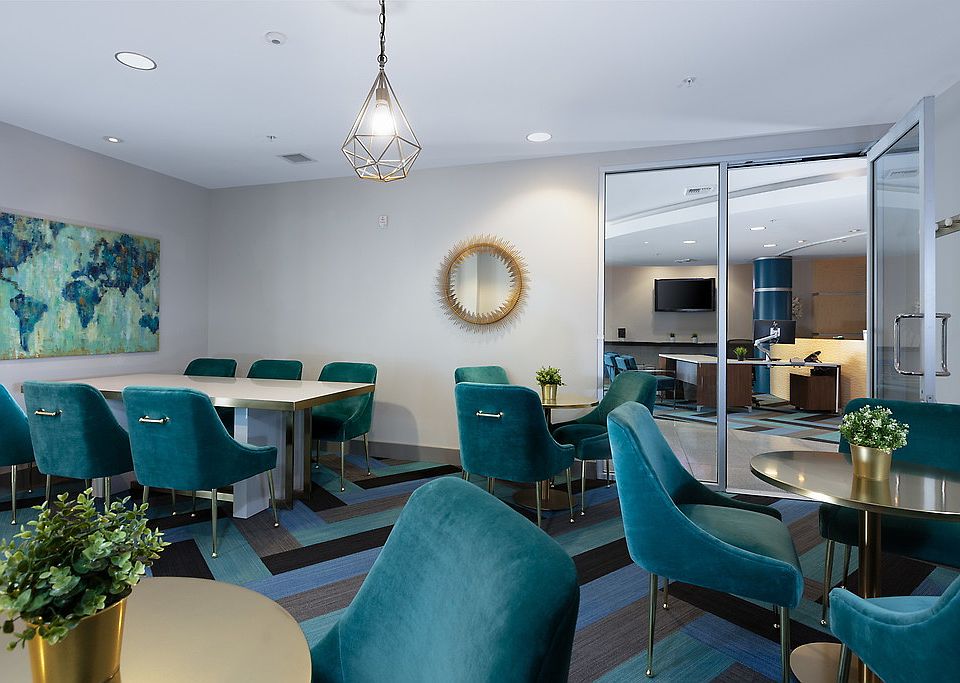 Lounge area with tables and chairs.