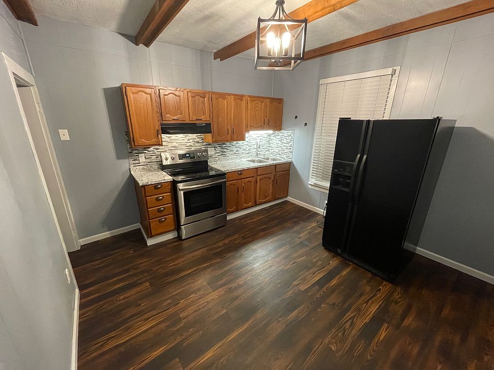 Just steps away from the parking lot, enter from a covered porch into your large eat-in kitchen.