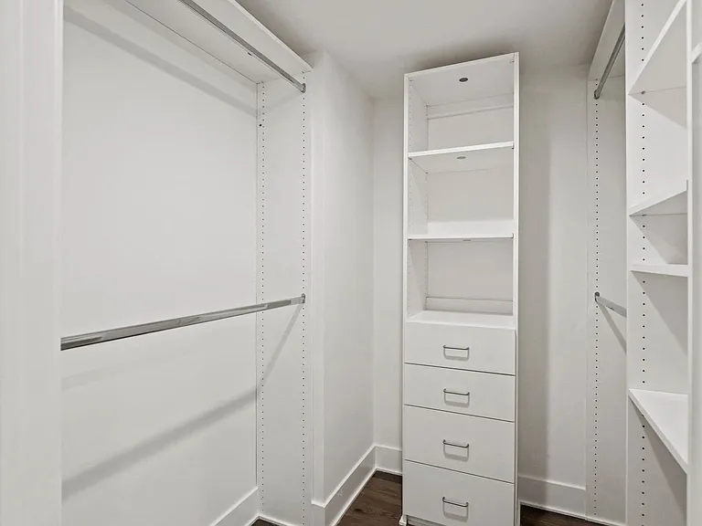 Walk-In a closet with Built-In Organizers and Shelving