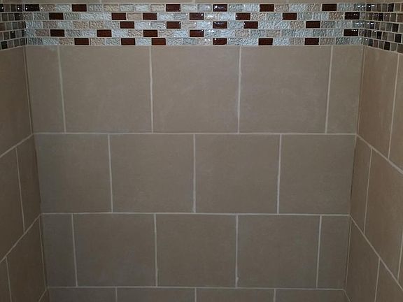 Newly re-tiled bath/shower