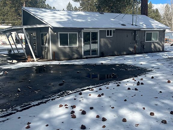 Side of apt. Perfect area for BBQ, outdoor table and chairs and hanging baskets. Also space to park.