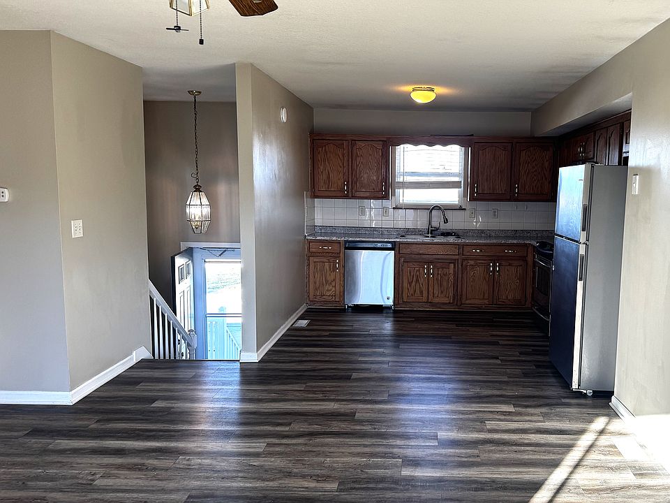 LOOKING AT ENTRY-KITCHEN AND LIVING AREA