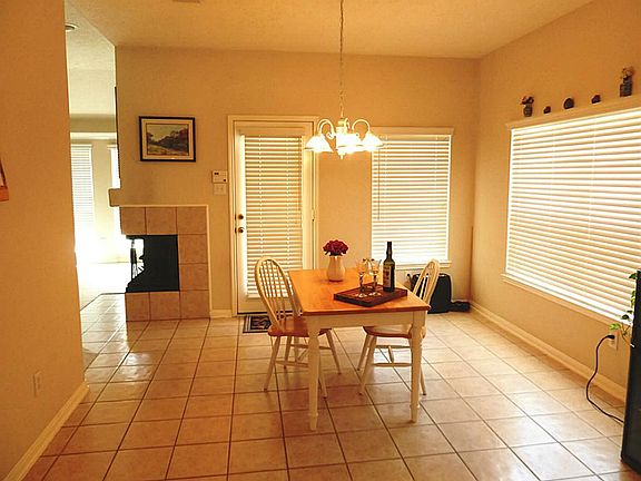 The breakfast room features easy care ceramic tile.