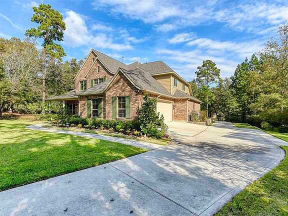 Three bay garage has generous back door entry and additional storage space at both back and sides.