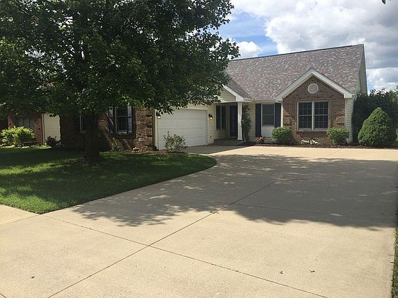 Front Street view with fresh landscaping and mature tree