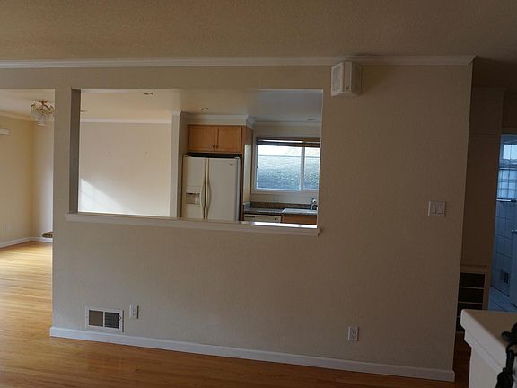 Living room looking into kitchen.