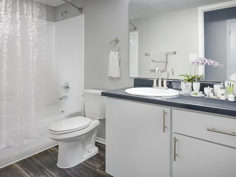 Well-appointed bathrooms are complete with ample storage.