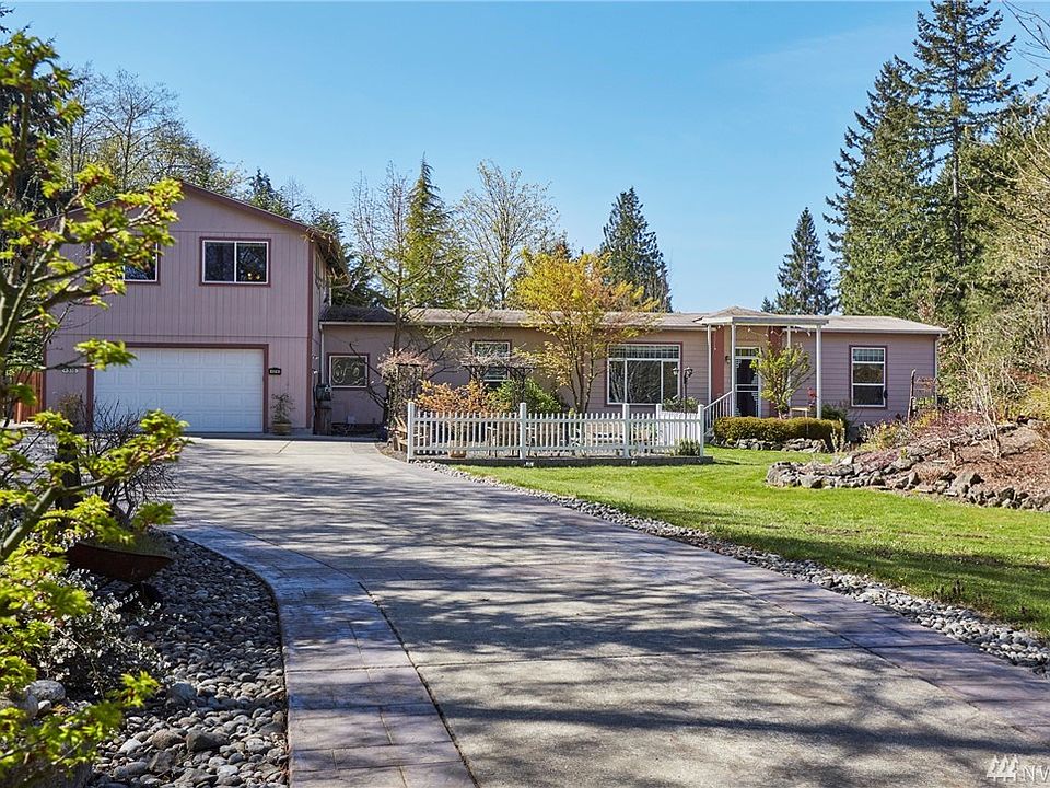 Enter your private oasis.  As you drive through the gate the waterfall greets you with it's own special music.  There is abundant parking areas just beyond the trees on your left.