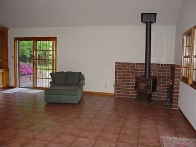Huge Family room with Fireplace, Spanish Tile Floors, Wood Dual Pane Sliders
