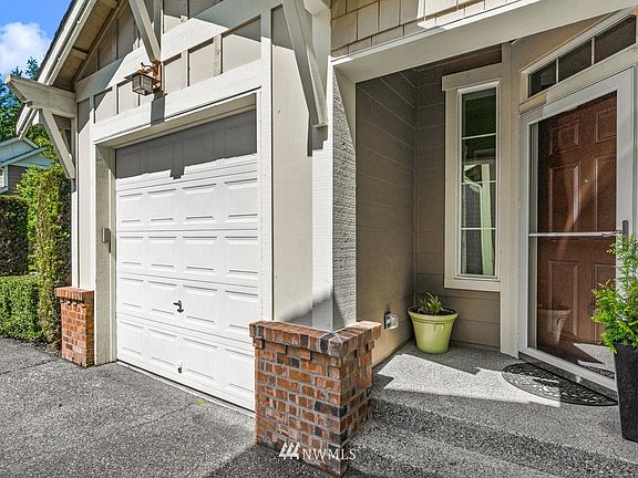 Attached 2 car garage with 2 separate entrances from inside the house.