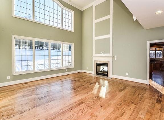 Soaring ceilings and gas fireplace in living room
