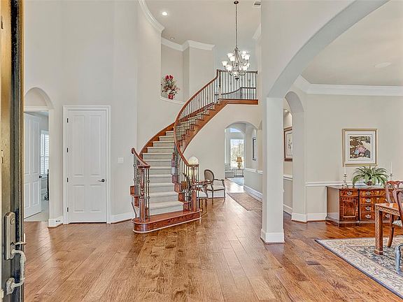 Enter into this magnificent two story foyer accented with structural design elements and the elegant winding stairwell.