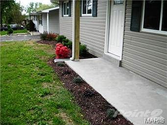 front walk with flowerbed