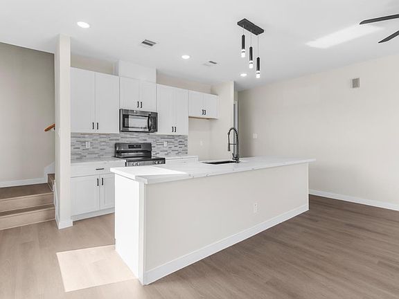 Open kitchen and living room floor plan.