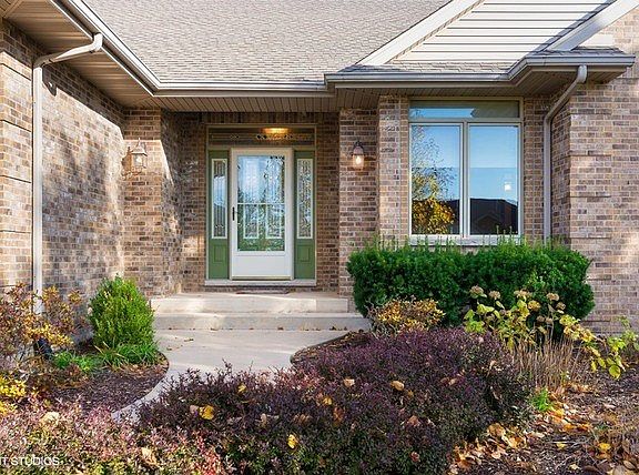 Inviting front porch and professionally landscaped yard!