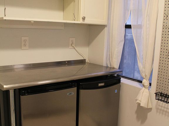 Kitchen w/ under counter freezer (left) and fridge (right)