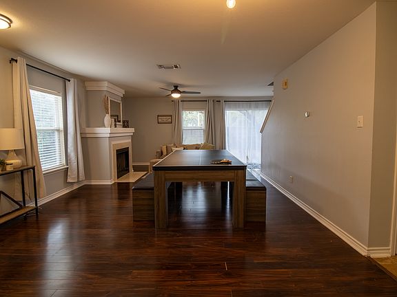 First living room with convertible dining/ ping pong/ pool table