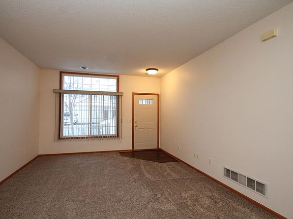 Living room and front entry. Brand new carpet and entry flooring.