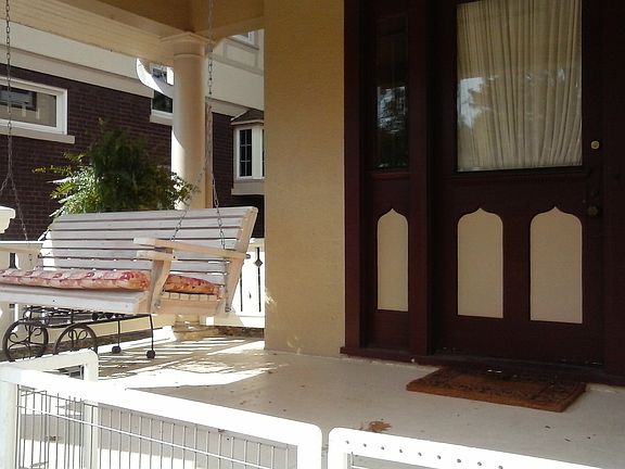 Covered front porch w/ swing