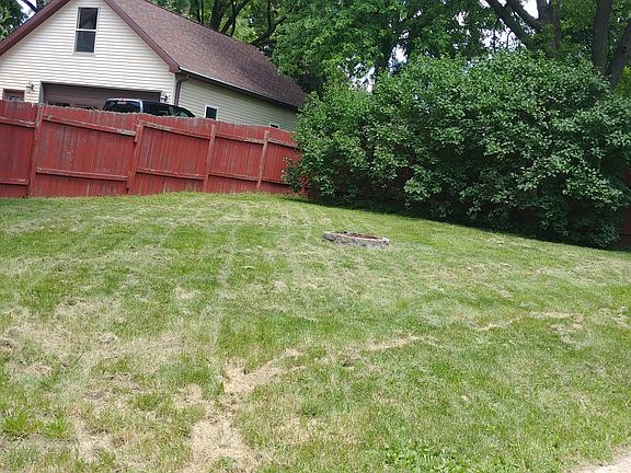 fenced yard and firepit