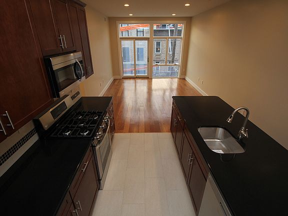 Featuring a Kitchen Island, with an open floorplan concept into the living room with a balcony!