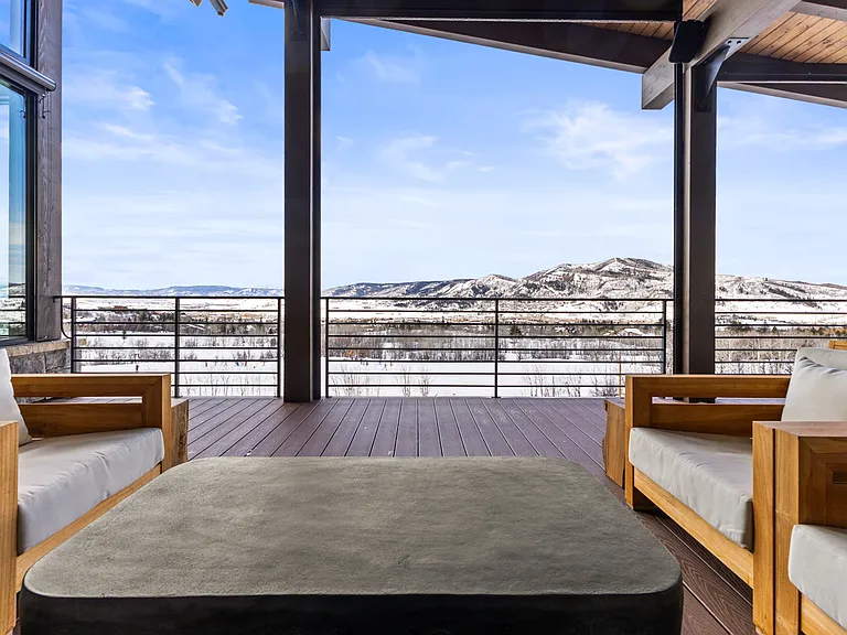 Main Level Wraparound Covered Deck with a view