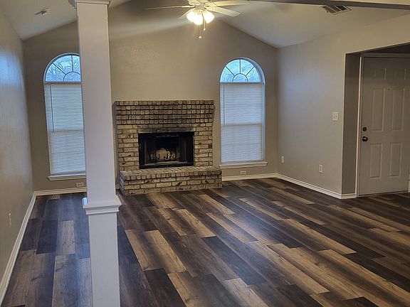 Living Area with wood burning gas fire place.