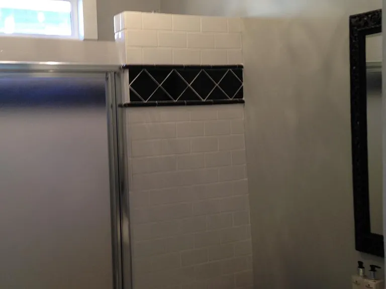 back full bathroom with huge shower, upgraded tile and lighting