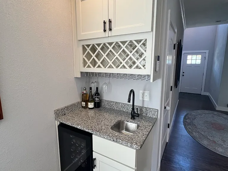 Wet bar with wine storage and fridge