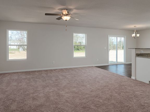 Open floor plan with warm natural light