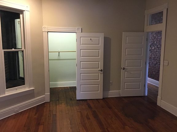 Bedroom with a view into the huge closet (photo doesn't do j