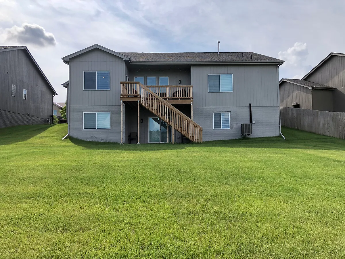 Back view of the house with a deck and walkout basement - S 176th St