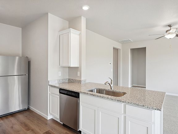 The family room of the Chatfield is located right off the kitchen.