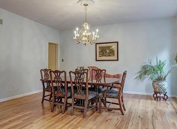 Large dining room is perfect for entertaining guests with easy access through the butler's entry to the kitchen.