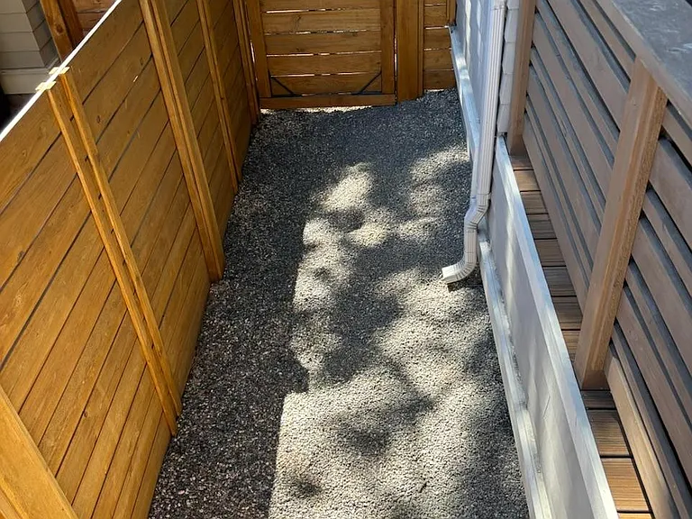 Gated Dog run along the side of the house